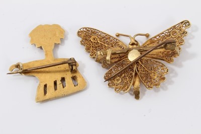Lot 204 - Two Middle Eastern yellow metal rings, yellow metal elephant palm tree brooch and yellow metal filigree butterfly brooch (4)