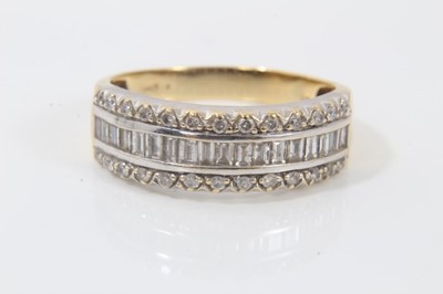 Lot 241 - 18ct gold diamond three row ring with baguette cut diamonds flanked by two rows of brilliant cut diamonds