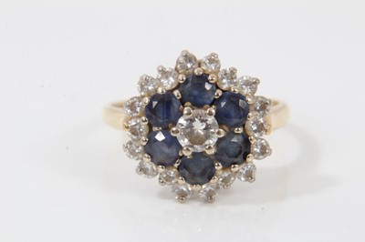 Lot 243 - 18ct gold sapphire and diamond cluster ring in tiered setting