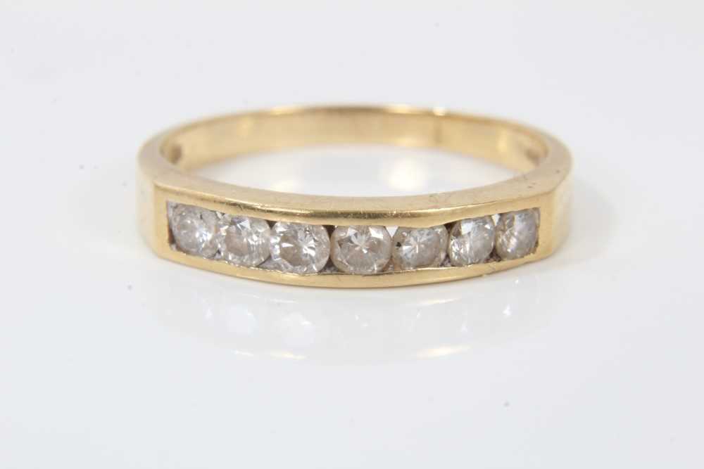 Lot 246 - 18ct gold diamond seven stone half eternity ring in channel setting