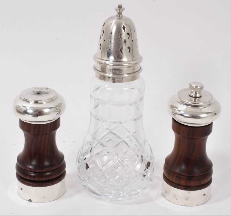 Lot 306 - Contemporary silver mounted turned wood salt and pepper mills, together with a silver topped cut glass sugar caster (3)