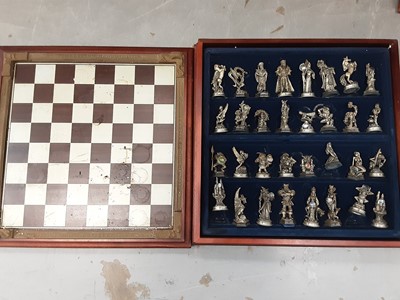 Lot 1280 - Danbury Mint pewter The Fantasy of the Crystal chess set, boxed