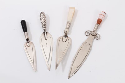 Lot 284 - White metal sword bookmark with banded agate handle and three silver trowel bookmarks (4)