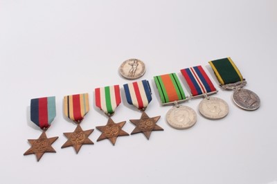 Lot 964 - George VI / Second World War medal group comprising 1939 - 1945 Star, France and Germany Star, Italy Star, Africa Star, Defence and War medals, together with a George VI Territorial Efficiency meda...