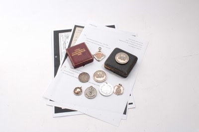 Lot 975 - Collection of eight Essex Regiment prize medallions and fobs including two in original boxes of issue, together with quantity of research about the recipients (8)