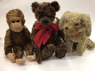 Lot 1751 - Selection of bears and soft toys including a two by Naomi Laight, large Bear 'Sammie" by Gund, Mumsie by Boyd, large mohair and felt monkey, large mohair seated dog plus two other small mohair dogs...