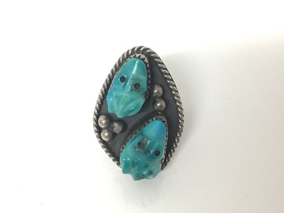 Lot 73 - Navajo style silver ring, of lozenge form, inset with turquoise-carved frogs, approx size M