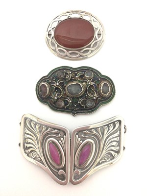 Lot 76 - Silver and agate brooch with pierced Celtic-style design, together with a silver-plated art nouveau buckle and an Eastern filigree and enamel brooch (3)
