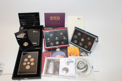 Lot 473 - G.B. - Royal Mint mixed proof and uncirculated issues to include proof sets 1970, 1971 x 2, 1983 (blue), 1990 (red), Royal Shield of Arms 2008, Silver Proofs - 90th Birthday £5 coin 1990, 'Olympics...