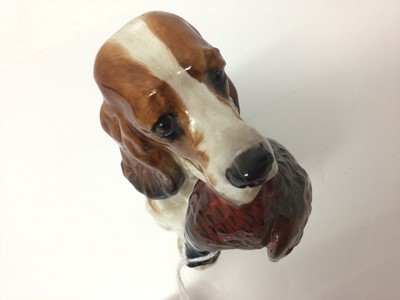 Lot 121 - Royal Doulton figure of a spaniel with a pheasant in its mouth, 13.5cm high