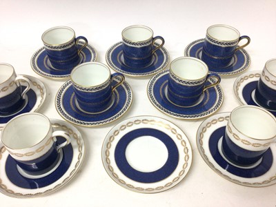 Lot 79 - Wedgwood five-person coffee set, decorated with gilt foliate patterns on a powder blue ground, together with a similar four-person Bisto coffee set, with one extra saucer