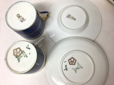 Lot 126 - Wedgwood five-person coffee set, decorated with gilt foliate patterns on a powder blue ground, together with a similar four-person Bisto coffee set, with one extra saucer
