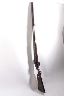 Lot 1090 - 19th century Indian percussion double barrelled sporting gun with heavy 20 bore barrels 82 cm , engraved locks , half stocked with steel mounts , patch box to one side, with ramrod 122 cm overall