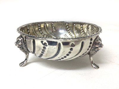 Lot 139 - Victorian silver sugar bowl of circular form with embossed beaded and reeded decoration on three hoof feet, (London 1884), 11cm diameter, 4.6ozs