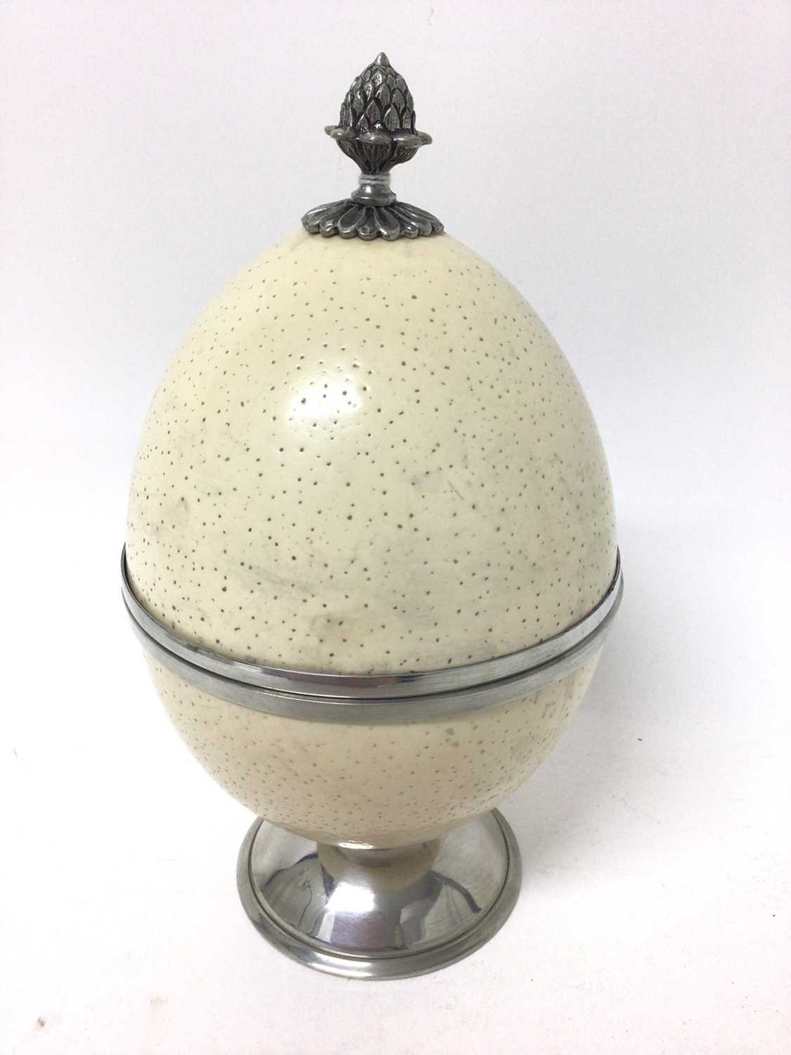 Lot 97 - Modern Continental pewter mounted ostrich egg urn and cover, 22cm high