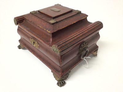 Lot 211 - Fine Regency red leather jewel/ needlework casket of sarcofogus form with gilt metal mounts , concealed correspondence compartment in lid, raised on gilt metal claw feet 27.5 cm wide, 21 cm deep, 1...