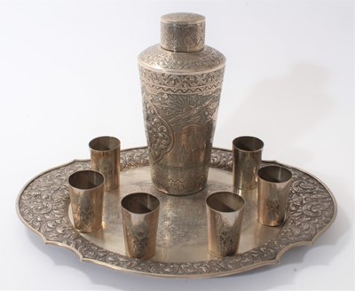 Lot 455 - Burmese silver cocktail shaker, six beakers and a tray