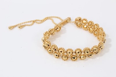 Lot 320 - Gilt beaded bracelet with two rows of faceted gold coloured beads on adjustable gilt chain with 9ct gold bar clasp