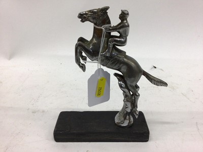 Lot 2046 - Chromium plated Desmo car mascot in the form of a jockey on horse back, 15cm in height (excluding base)