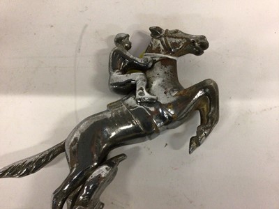 Lot 2046 - Chromium plated Desmo car mascot in the form of a jockey on horse back, 15cm in height (excluding base)