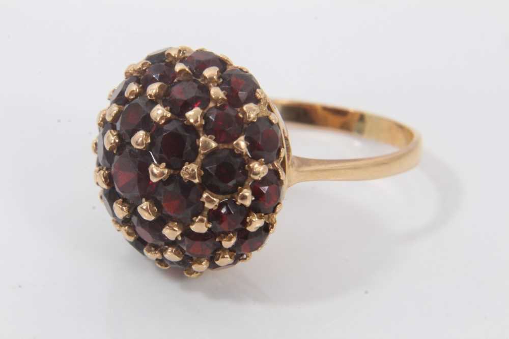 Lot 694 - 18ct gold garnet bombe cluster ring