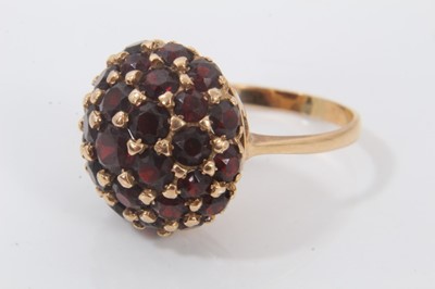 Lot 694 - 18ct gold garnet bombe cluster ring