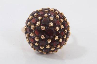 Lot 694 - 18ct gold garnet bombe cluster ring