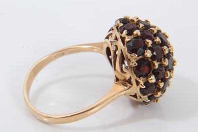 Lot 694 - 18ct gold garnet bombe cluster ring