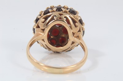 Lot 694 - 18ct gold garnet bombe cluster ring