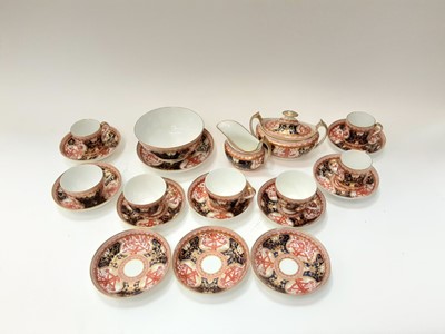Lot 1292 - 19th century English porcelain part tea service (probably by Spode) with Imari style decoration comprising slops bowl and stand, sucrier, milk jug, ten saucers, four tea cups and three coffee cans...