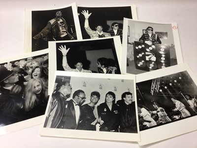 Lot 1600 - Michael Jackson Ninteen 1980's Black and White Press Release photographs by named photographers, Michael Jackson in London with fans, crowds, at Madame Tussauds Wax Works.  Photographers include...