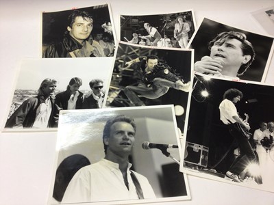 Lot 1607 - Photographs  - Quantity of 1980's Pop Star Portrait and Live Aid Press release and other photographs.  Stars include Freddie Mercury, David Bowie, Bob Geldof, Adam Ant, George Michael, Elton John e...