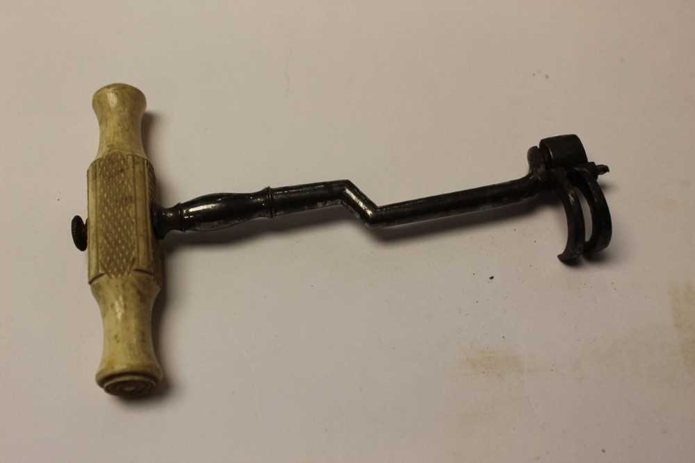 Lot 2550 - 19th century steel tooth key with bone