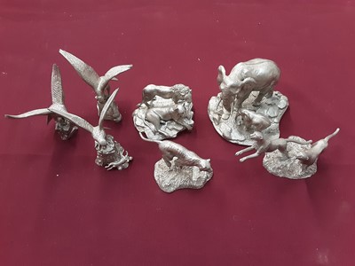 Lot 1296 - Four Buckingham pewter limited edition animal ornaments including elephants, lions etc and three pewter eagles (7)