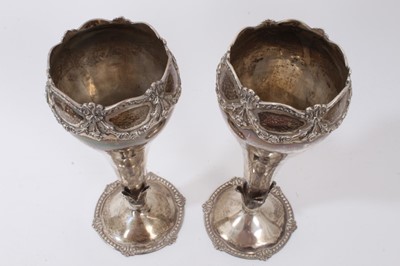 Lot 388 - Pair silver vases of tapering form with floral swag decoration