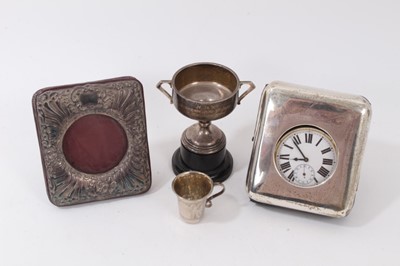 Lot 392 - Silver pocket watch holder with Goliath pocket watch, silver photograph frame, small silver trophy and miniature silver cup