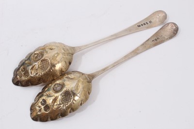 Lot 394 - Pair Georgian silver berry spoons together with four Victorian silver plated tablespoons in fitted case