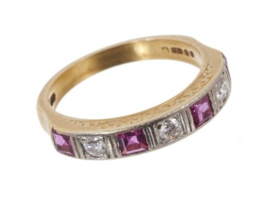 Lot 600 - Ruby and diamond seven stone eternity ring with with four square step cut rubies interspaced by three brilliant cut diamonds