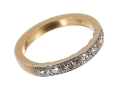 Lot 601 - Diamond eternity ring with a half hoop of seven brilliant cut diamonds in platinum grain setting on 18ct yellow gold shank