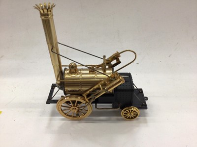 Lot 1822 - Good quality model of a three-wheeled steam driven carriage together with a battery operated Stephenson's Rocket (2)