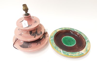 Lot 1313 - 19th century Majolica wall plate together with a French pottery table lamp with painted mark to base, Dreyfous, France (2)