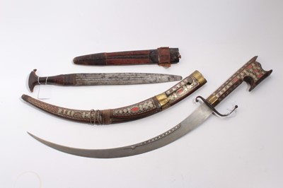 Lot 1047 - Eastern sword with curved steel blade in wooden sheath with inlaid decoration, together with an African knife in leather sheath