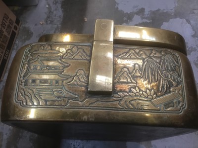 Lot 2706 - Late 19th century Chinese brass carriage warmer with ornate pierced cover and cast landscape decoration with swing carrying handle 40 cm wide