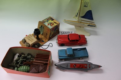 Lot 1869 - Two large boxes of children's toys and games including pond yacht, Popeye, hoopla, childrens play guns etc
