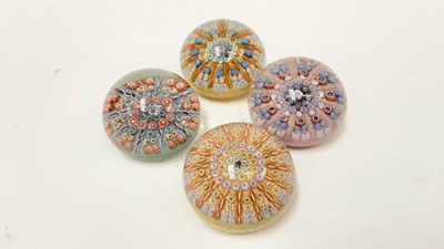 Lot 1133 - Four Perthshire glass paperweights with cartwheel designs, approx 80mm diameter