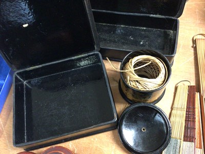 Lot 425 - Two Japanese papier-mâché boxes and string box, three other containers and four fans