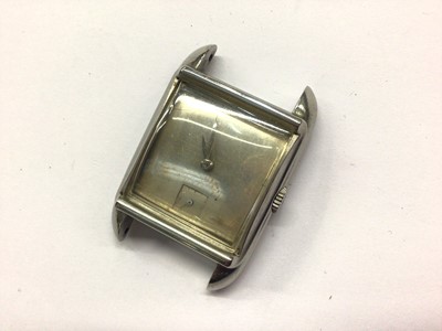 Lot 667 - 1940s Omega wristwatch in stainless steel case rectangular cushion shaped case with plain silvered dial