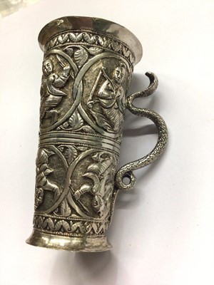 Lot 677 - Eastern white metal double spirit measure, relief-decorated with roundels containing figures and snake-form handle