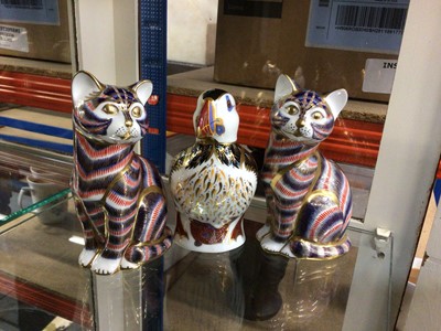 Lot 103 - Three Royal Crown Derby ornaments - two cats and puffin