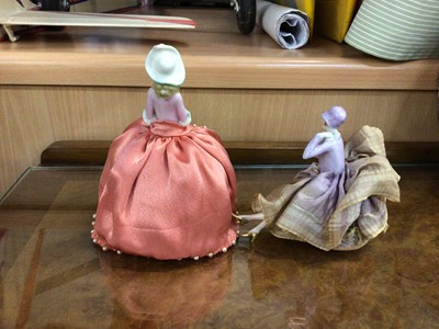 Lot 110 - Two 1920s porcelain lady pincushions and decorative ornaments